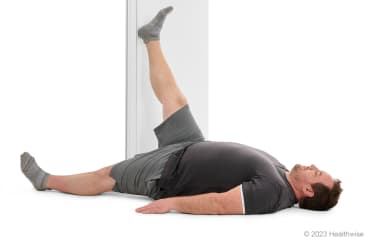 Hamstring stretch in a doorway Video & Image