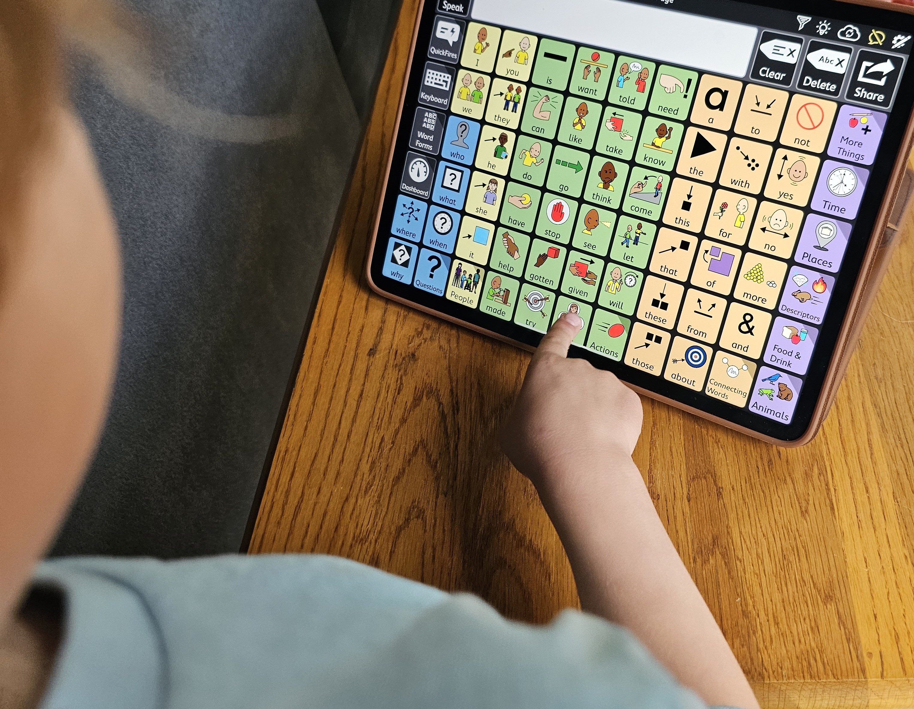 child with high tech AAC device