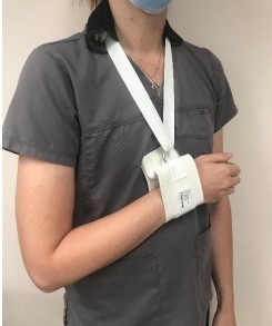 person wearing cuff and collar sling