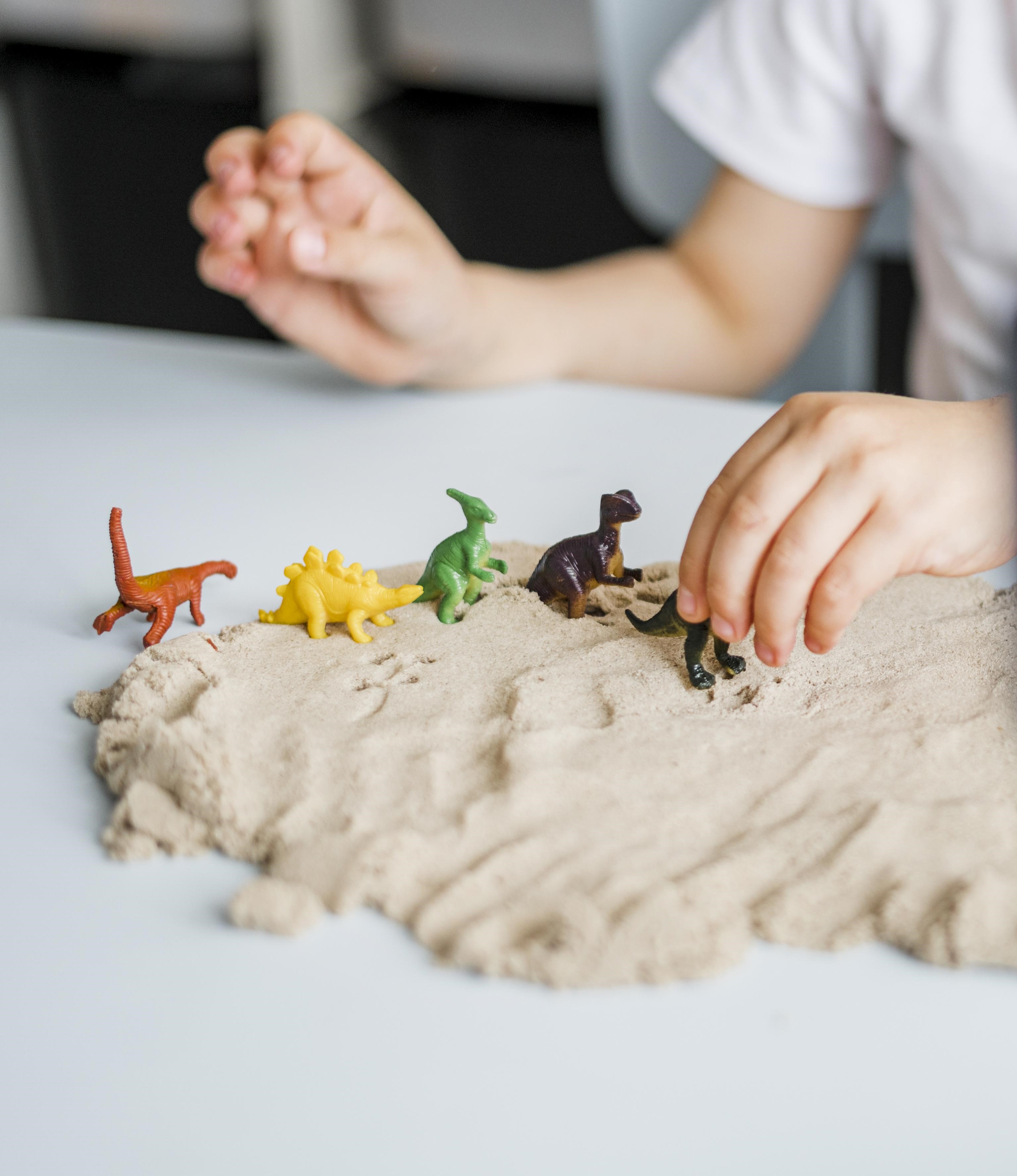 child playing with toys in playdoh