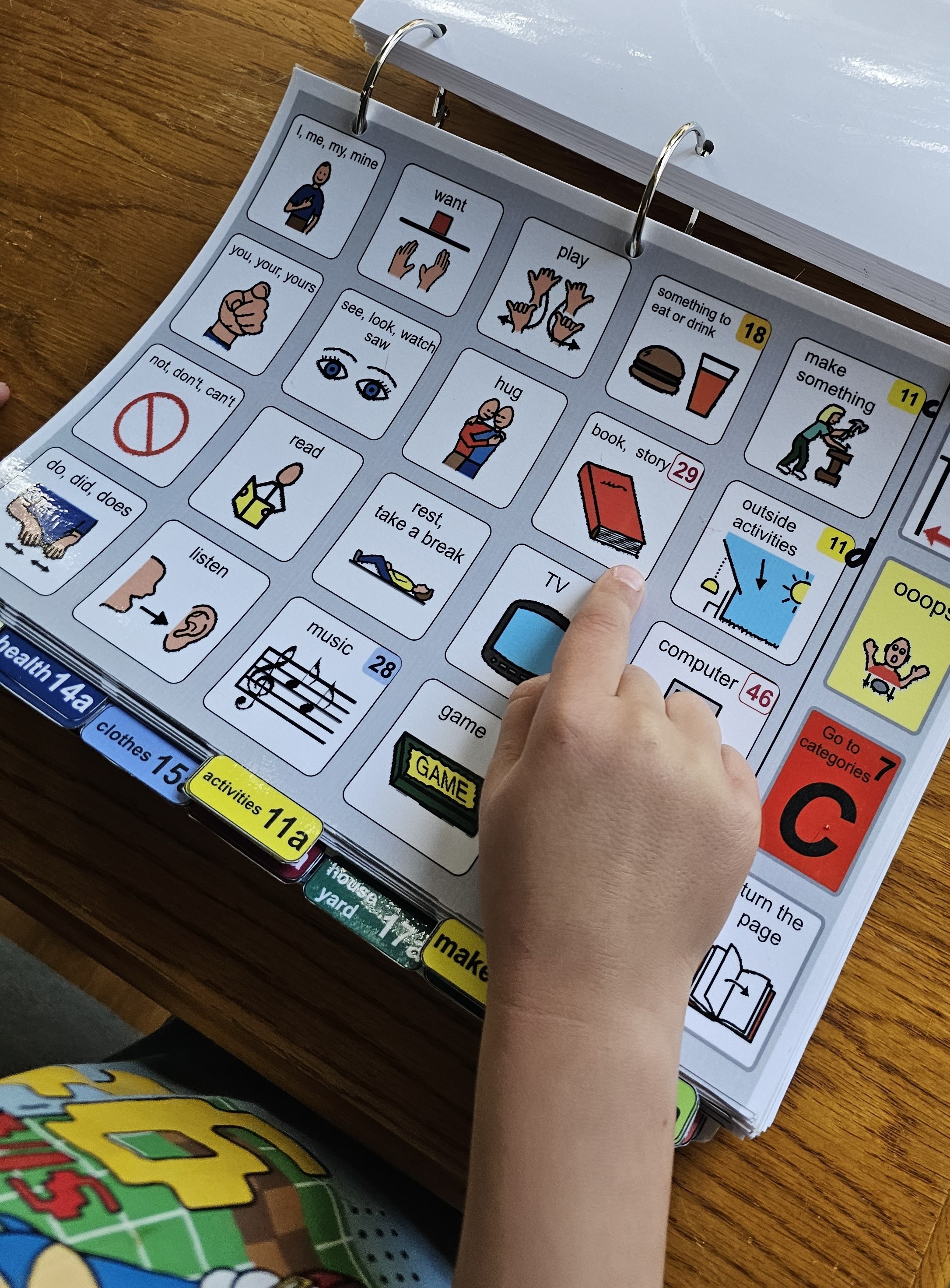 child with low tech AAC device