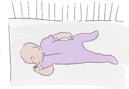 baby lying on side looking right